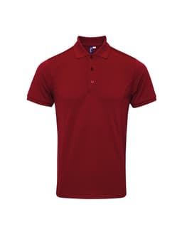 A red polo shirt with a collar and three buttons, featuring a small logo on the chest area.