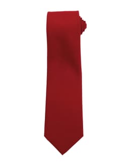 A red tie with a pointed end, featuring a simple design and an attached logo.