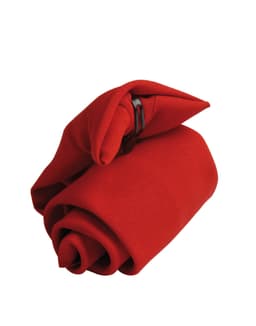 A red tie folded into a rose shape, secured with a clip. It features a simple design suitable for formal wear.
