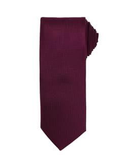 A burgundy micro waffle tie with a textured pattern and a logo.