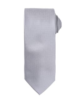 A micro waffle tie in a light grey tone, featuring a textured pattern and a rolled design at the end.