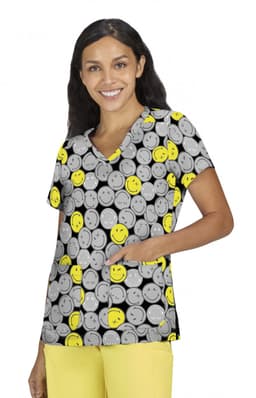 A top featuring a vibrant grey background adorned with smiling yellow faces, with a pocket and short sleeves.