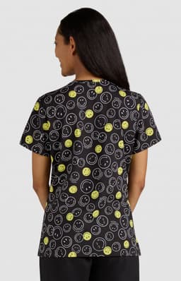 A T-shirt featuring a black background with vibrant yellow and white smiley face patterns. It has a logo on the back.