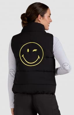 A black padded vest featuring a large yellow smiley face on the back. No visible logos or text.