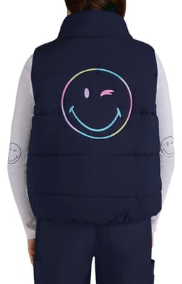 A navy vest with a large pastel smiley face graphic on the back. It features a collar and is quilted.