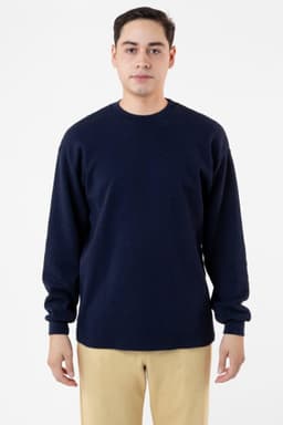 A navy blue heavy thermal crewneck jumper with long sleeves and a relaxed fit, featuring a subtle logo.