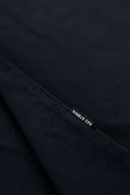 A navy T-shirt featuring a small tag, with a logo visible on the hem.