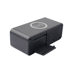 A black wireless charging speaker with a sleek design and a wireless charging pad on top.