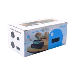A wireless charging speaker and alarm clock in a box, featuring a dark exterior and display for time settings.