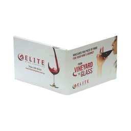 A promotional brochure with a glossy finish, featuring red wine and a woman sipping from a glass. It has a logo.