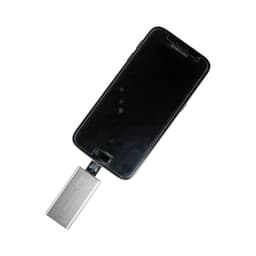 A silver Banion OTG USB 3.0 flash drive connected to a black smartphone. The device has a logo on it.