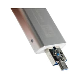 A silver USB flash drive with a blue connector, featuring a branded logo.