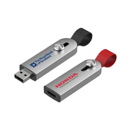 A silver flash drive with a black and red strap, featuring branding on both sides.