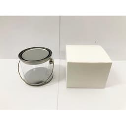 A medium clear PVC bucket with a metal handle next to a plain white box.