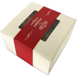 A window box with a festive red and cream design, containing assorted cookies.
