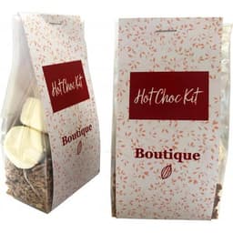 A packaged hot chocolate kit featuring white marshmallows and chocolate flakes in a vibrant red and white design.