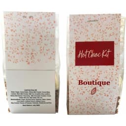 A packaging for a Hot Chocolate Kit featuring a red and white design with chocolate ingredients visible in a clear pouch.