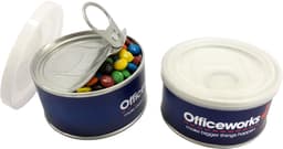 A small pull can with a silver lid, filled with colourful Mini M&Ms, featuring a logo on the side.