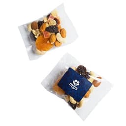 A packet of fruit and nut mix featuring almonds, cashews, dried fruits, and a branding logo in dark blue.