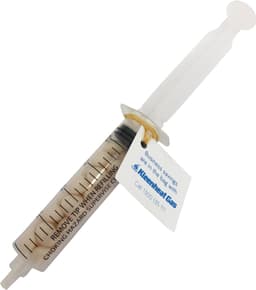 A syringe filled with white mints, featuring a clear plastic body and an attached tag with a logo.