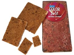 A transparent pack containing several pieces of freeze-dried strawberries in a rich red colour.