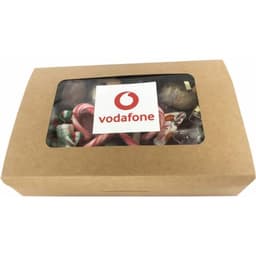 A kraft gift box filled with assorted confectionery, visible through a clear window, featuring a logo on the front.