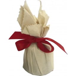 A Christmas pudding wrapped in cream fabric with a red ribbon detail. Features a simple, festive presentation.