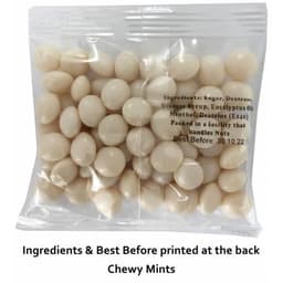 A clear plastic bag filled with white chewy mints. The pack includes a logo and ingredient information on the back.