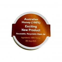 A glass jar of Australian honey with a brown and gold label, featuring a logo and recyclable details.