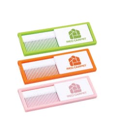 A set of three combs in green, orange, and pink, each with a white casing featuring a logo.