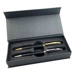 A black and gold metal pen gift set displayed in a grey box, featuring two pens with a logo.