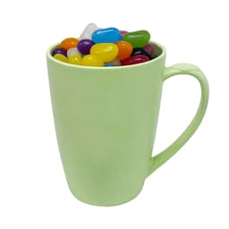 A light green bamboo mug filled with assorted colourful jelly beans and featuring a handle.