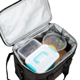 A large black nylon cooler bag with silver interior, containing various containers of food and fruit.