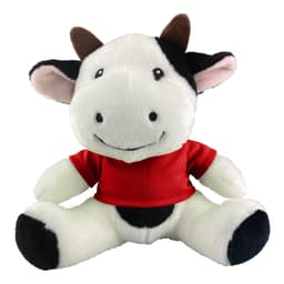 A plush cow toy with black and white fur, wearing a red shirt and featuring a smiling face.