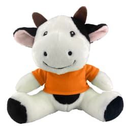 A plush cow toy with black and white fur, wearing an orange shirt, featuring a friendly smile and brown horns.