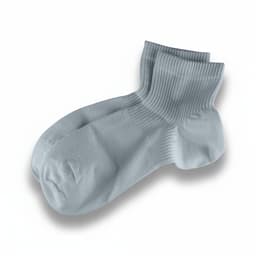 Light blue socks with a ribbed texture, featuring a logo on one side.