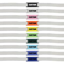 A row of white shoelaces featuring various coloured luxury shoelace charms in multiple designs and shades.