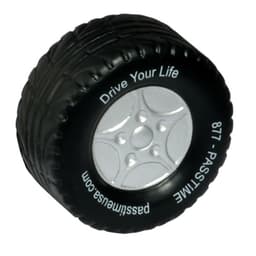 A black stress reliever shaped like a tyre with silver detailing and a logo on the side.