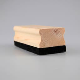 A wooden whiteboard eraser featuring a smooth wooden top and a black felt bottom.