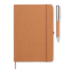 A tan notebook with a textured cover and an elastic band, accompanied by a silver pen.