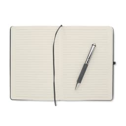 A notebook with lined pages and a grey pen resting on it. The notebook features a black cover.