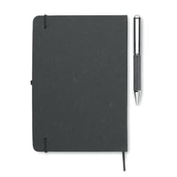 A grey notebook with a pen resting beside it, featuring a logo on the cover.