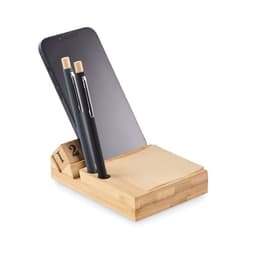 A bamboo desk organiser featuring a slot for a phone, two pens, and a pad of sticky notes in natural tones.