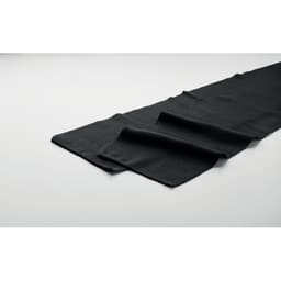 A black fabric mat or runner laid flat, displaying a soft texture and smooth finish. It has a simple, elegant design.