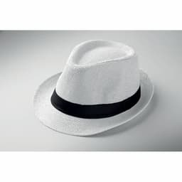A white straw fedora hat with a black band resting on a neutral background.