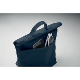 A bag in navy blue featuring a front pocket with a smartphone and sunglasses visible. It has a handle for carrying.