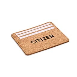A cork card holder with three slots for cards and a logo, showcasing a natural textured appearance.