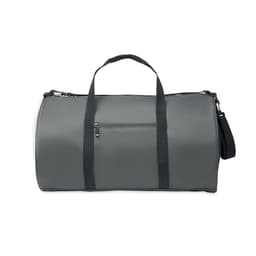 A grey duffle bag with black straps and a zip pocket on the front, featuring a logo on the side.