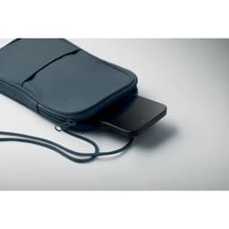 A navy Korovin Pouch with a smartphone partially visible inside, featuring a zip closure and a strap.