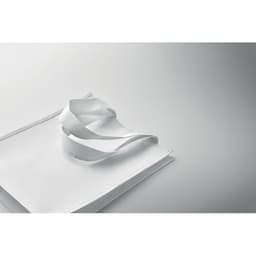 A white drink bottle with a sleek design, featuring a curved white strap and set against a grey background.